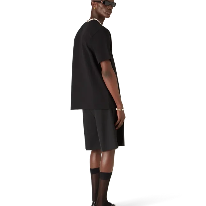 Camiseta de pantalón corto con pelota de tenis de manga