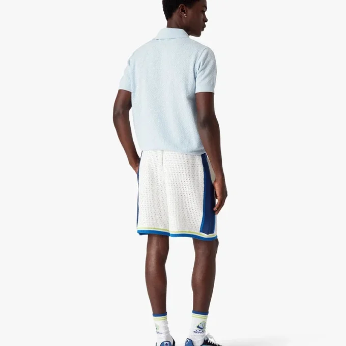 Polo de pantalón corto con monograma azul en punto calado