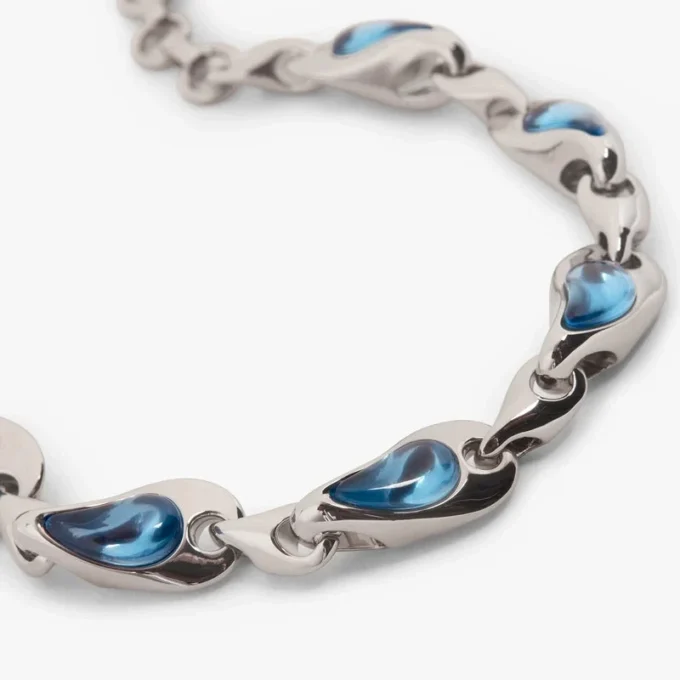 Pulsera de latón con gotas de agua en tonos plateados y azules
